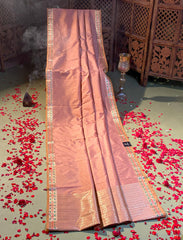 Coaral pastel peach crepe silk saree with minakari work.
