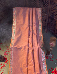 Coaral pastel peach crepe silk saree with minakari work.